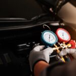 Hand,Of,Car,Mechanic,Technician,Use,Meter,To,Check,Car