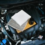 Car,Air,Filter,And,Car,Oil,Filter,On,Engine,Cover