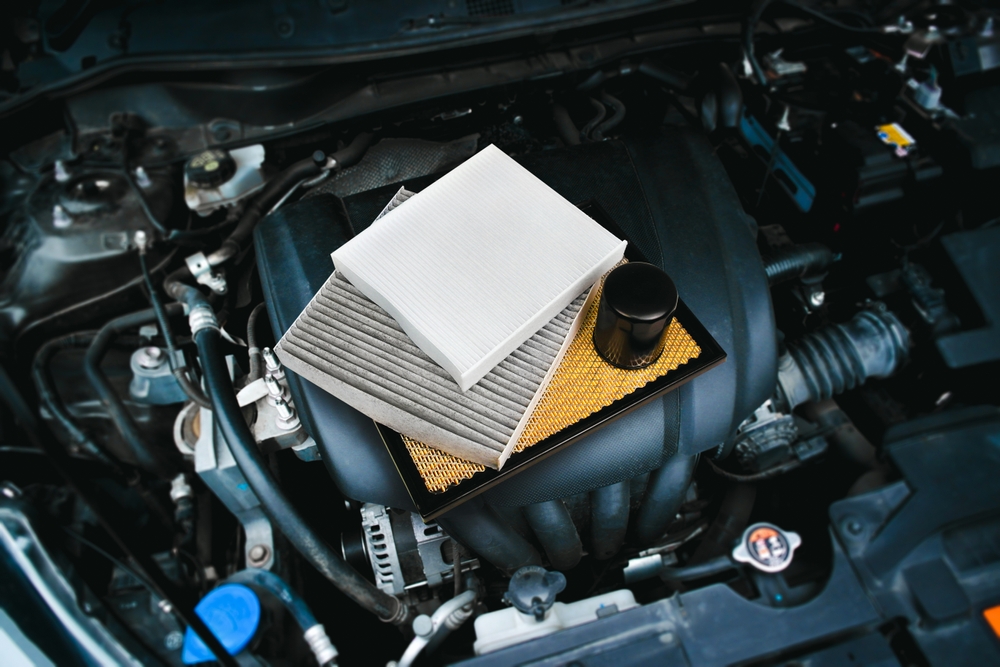 Car,Air,Filter,And,Car,Oil,Filter,On,Engine,Cover