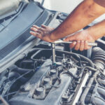 Garage,Auto,Car,Service,Professional,Mechanic,Man,Checking,And,Fixing