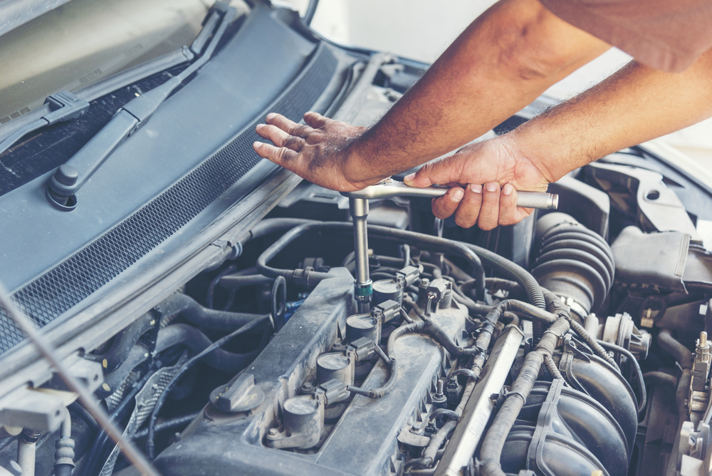 Garage,Auto,Car,Service,Professional,Mechanic,Man,Checking,And,Fixing