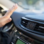 Female,Hand,Checking,Air,Conditioning,Panel,Inside,Car.,Woman,Driver